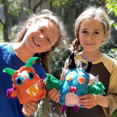 children holding stuffed animal crafts