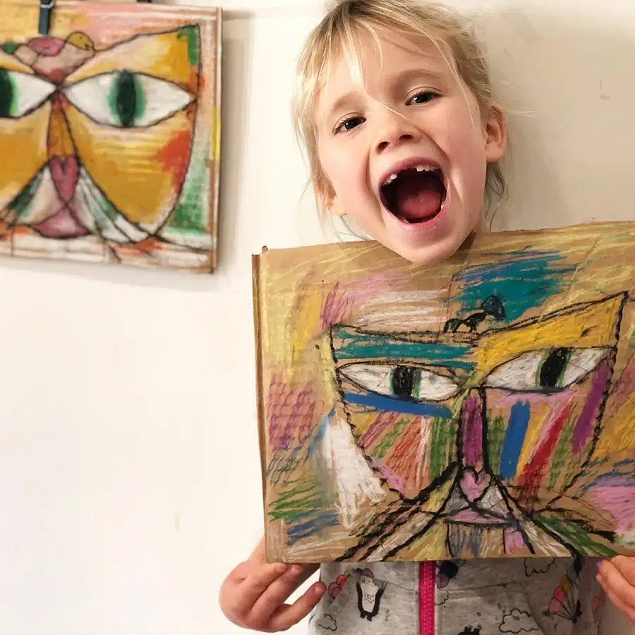 child with drawing of a cat
