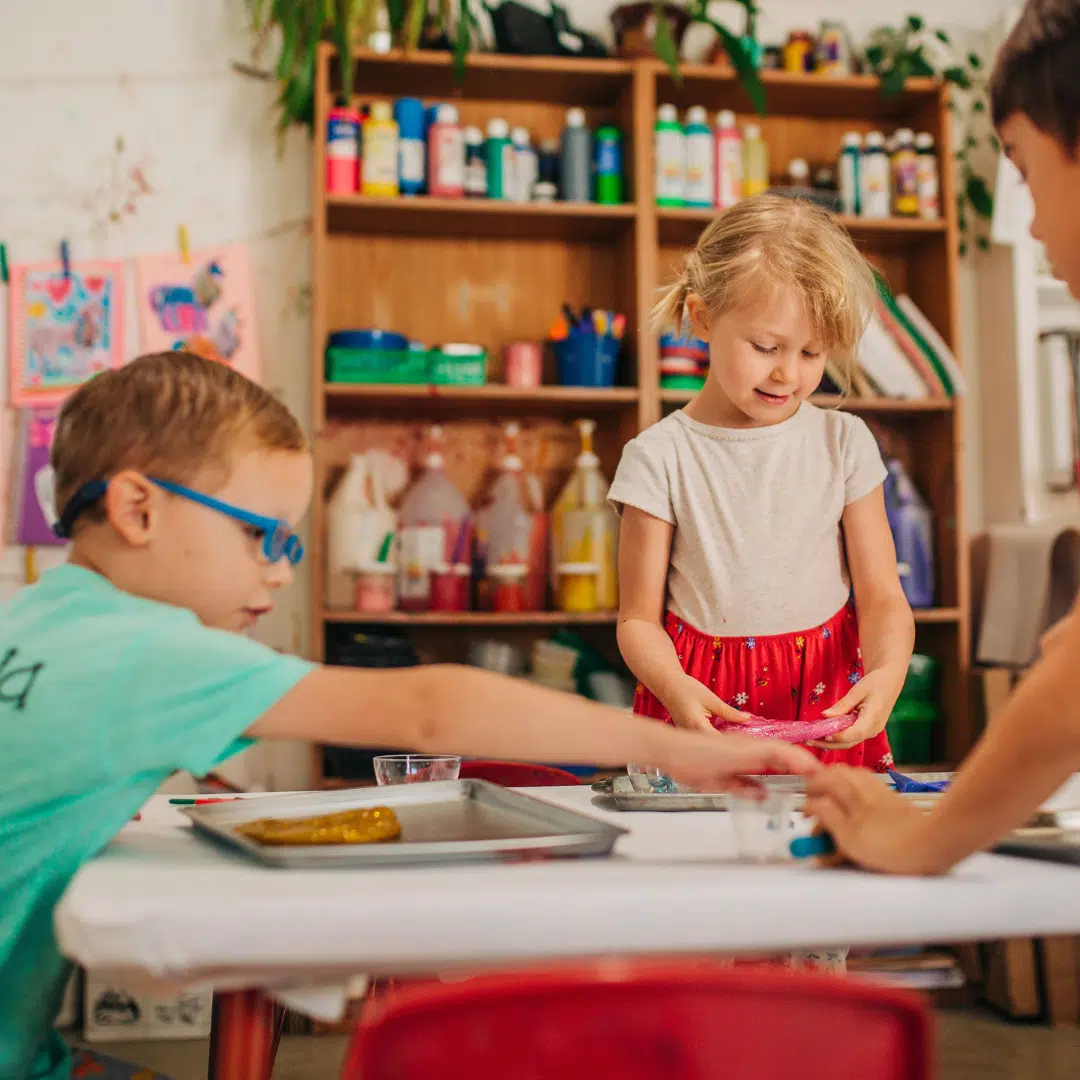 children making crafts at birthday party