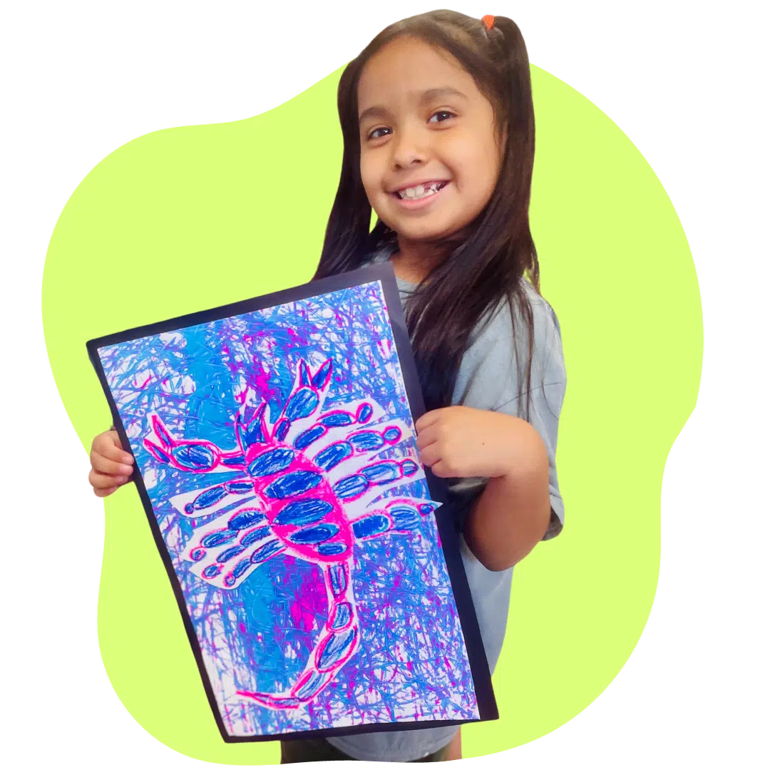 child showcasing her artwork