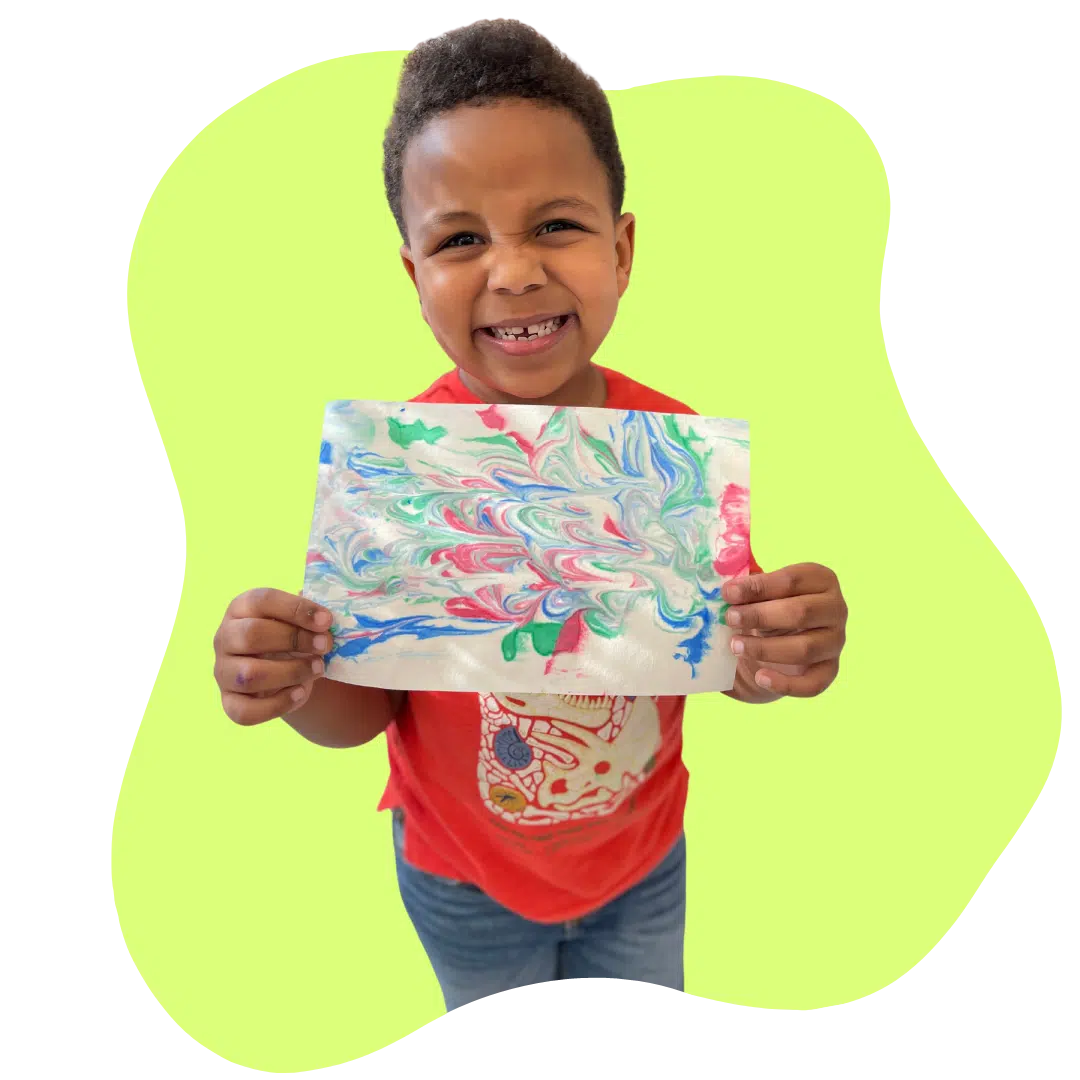 boy holding artwork