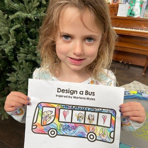 child with picture of a bus